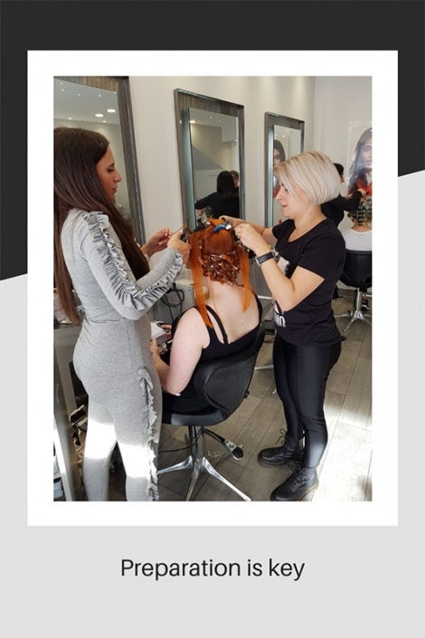 Two stylists preparing our model