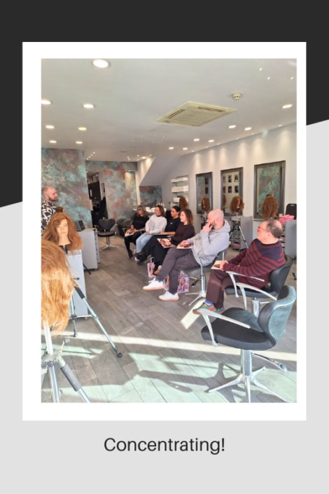 Stylists at the salon being taught by Andrew Smith