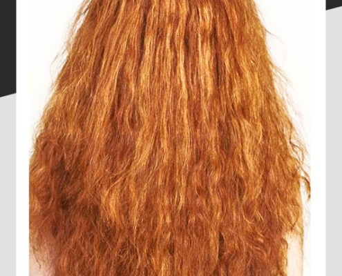 Frizzy long red hair.
