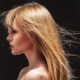 Woman with very wispy hair blowing everywhere