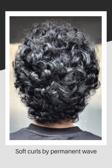 Male with permed soft curls
